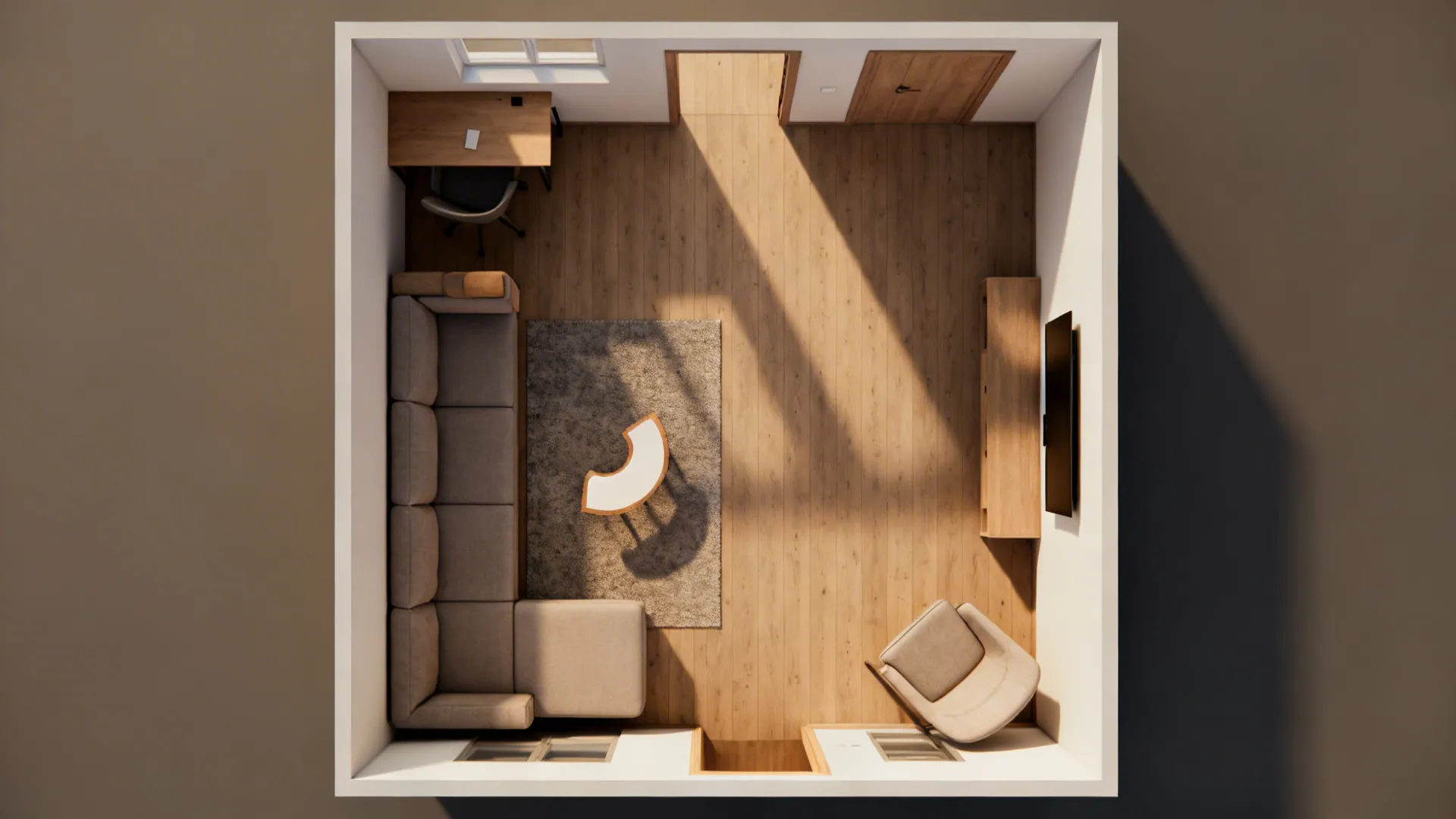 Top-down view of an L-shaped seating layout with a small desk behind the sofa and clear pathways.