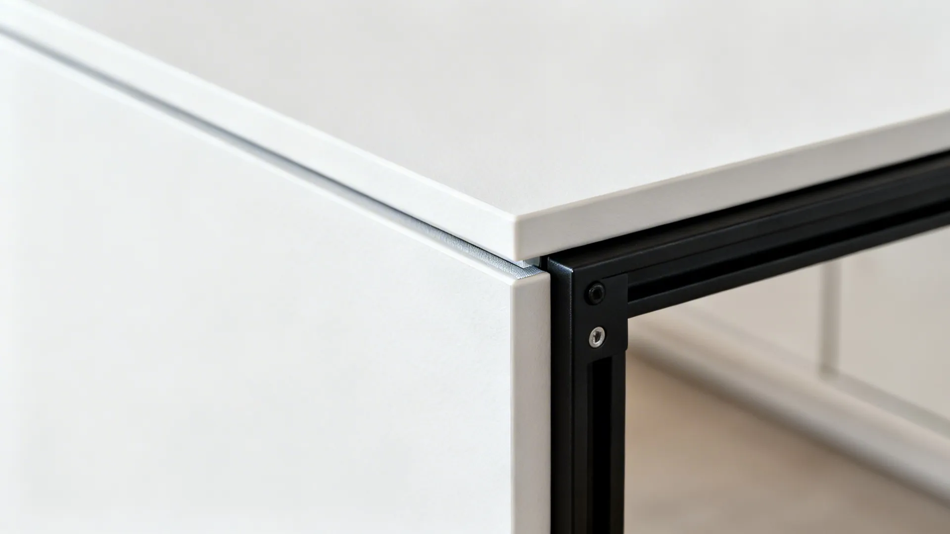Macro of matte HPL panel edge and black rail bracket showing fine texture and clean joinery.