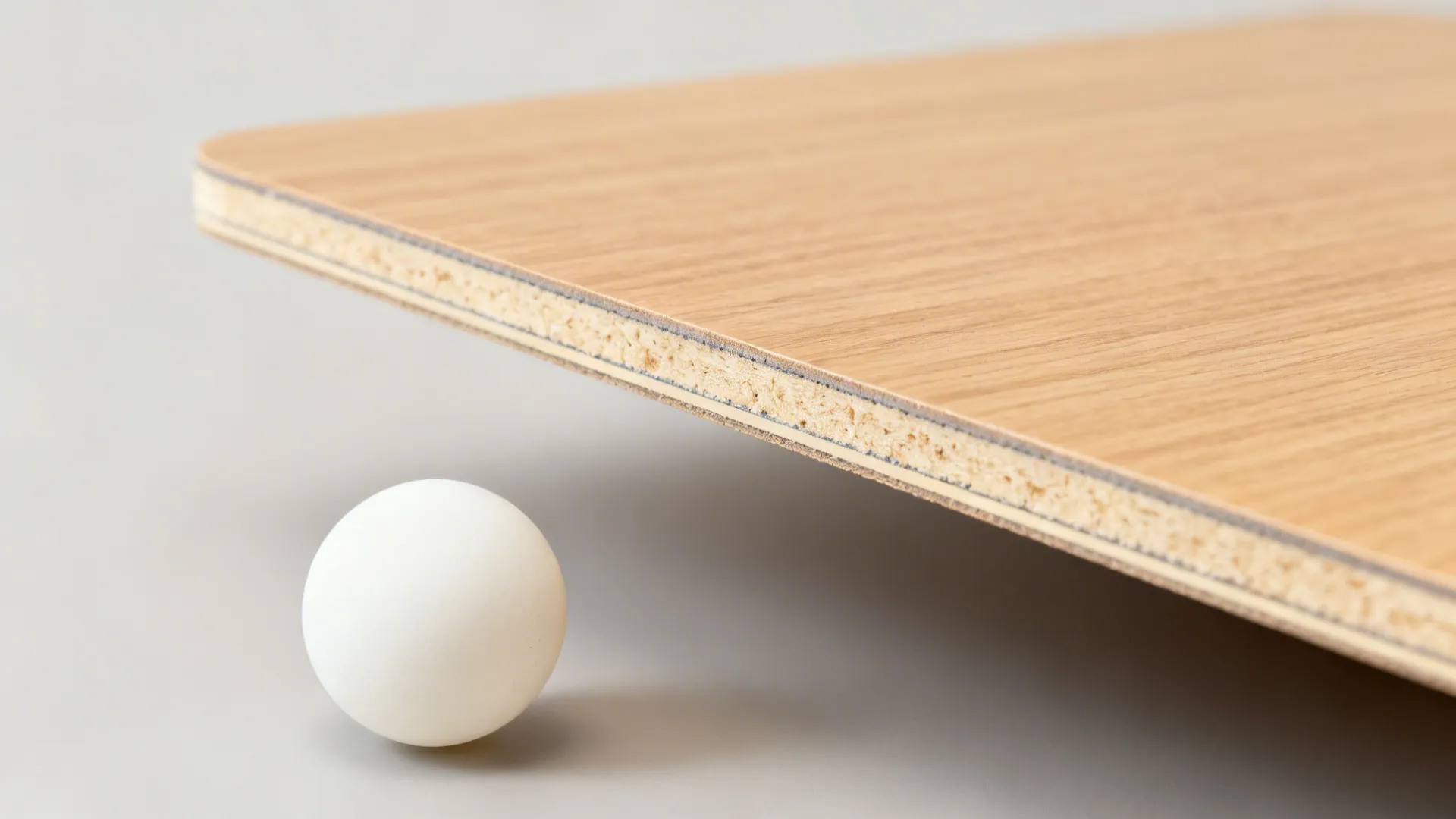 Macro cross-section of a laminate-faced panel with clean edge banding and smooth surface