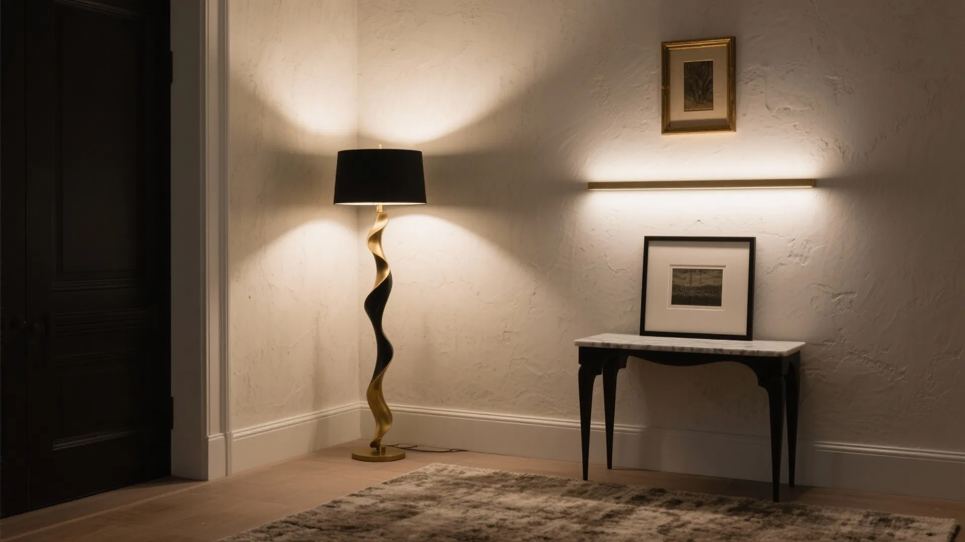 Elegant corner with a gold floor lamp marble table framed art and warm wall light