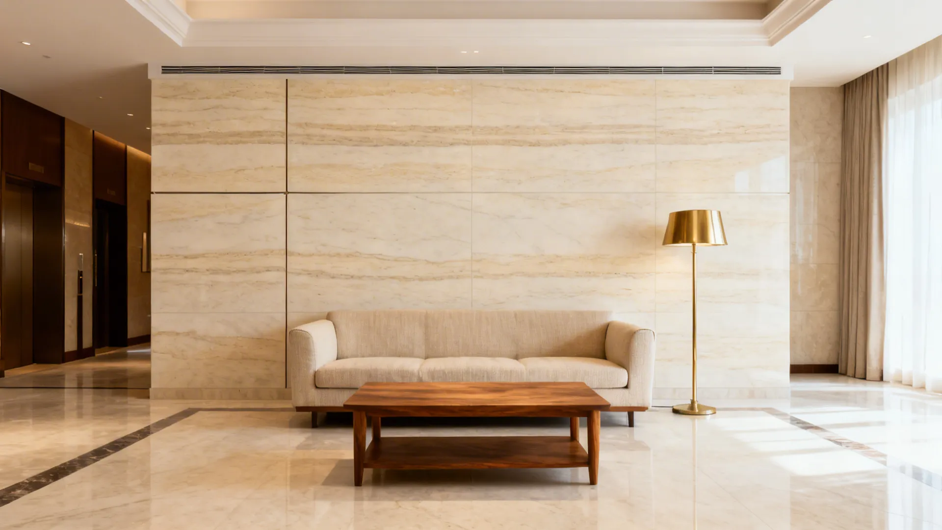 Modern living room with beige stone wall, cream sofa, wooden coffee table, and gold floor lamp