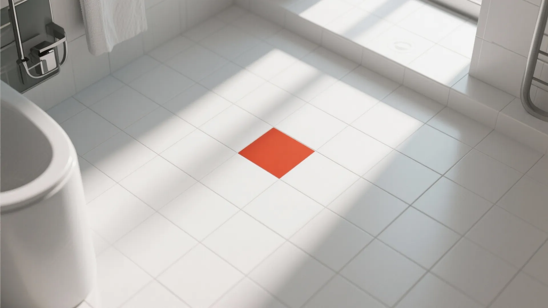 White square floor tiles in a bathroom with one single red tile placed in center