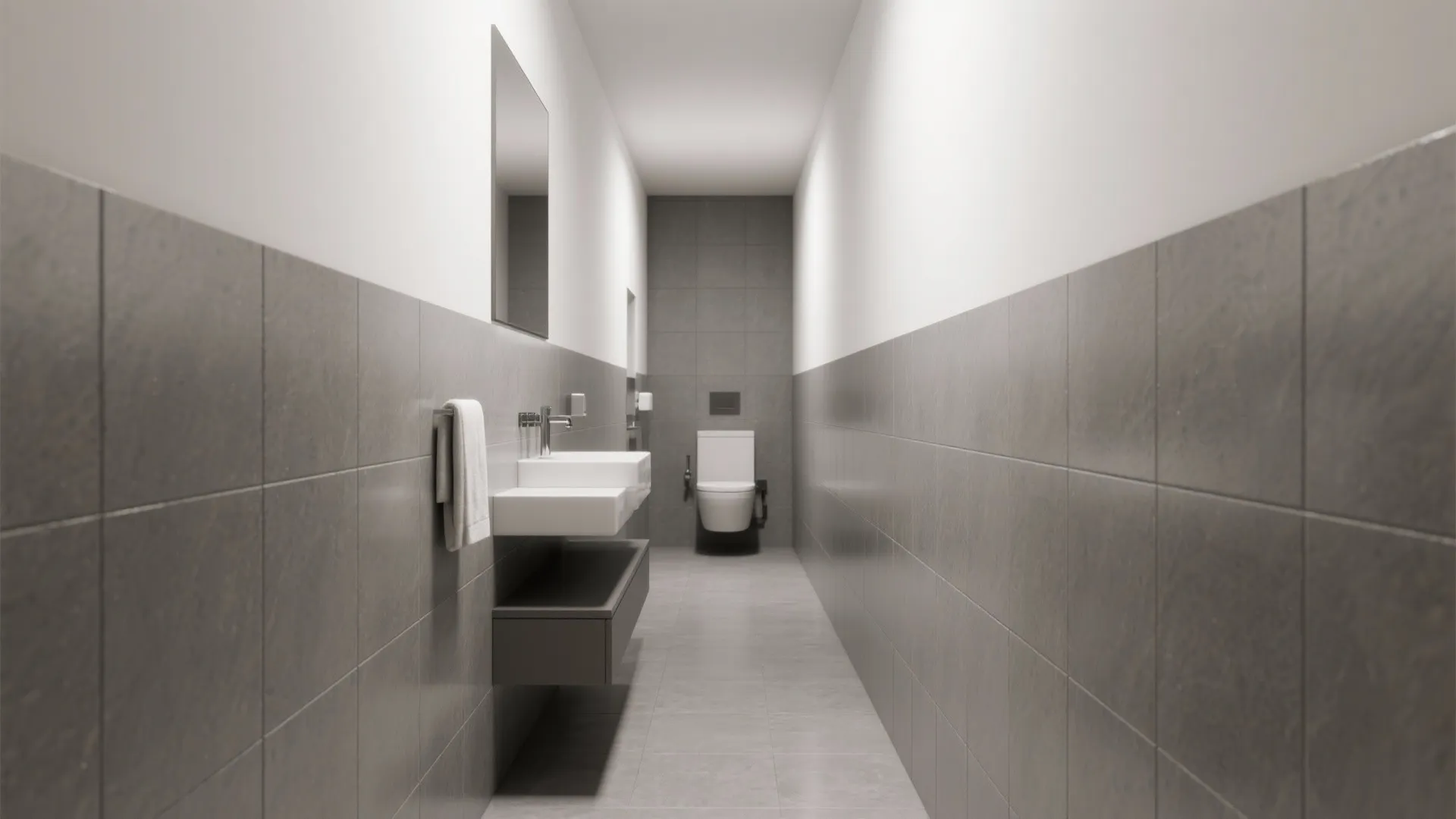 Modern narrow bathroom with grey wall tiles white sink mirror toilet and simple lighting design