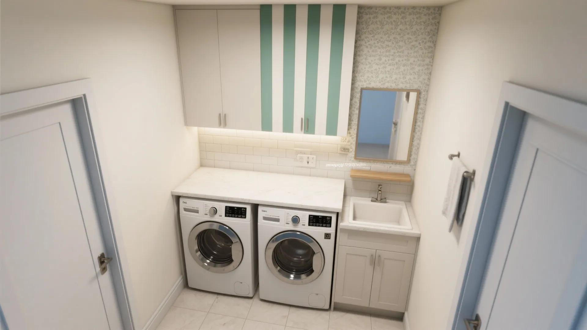 Modern laundry room with white washing machines under counter next to small sink and mirror