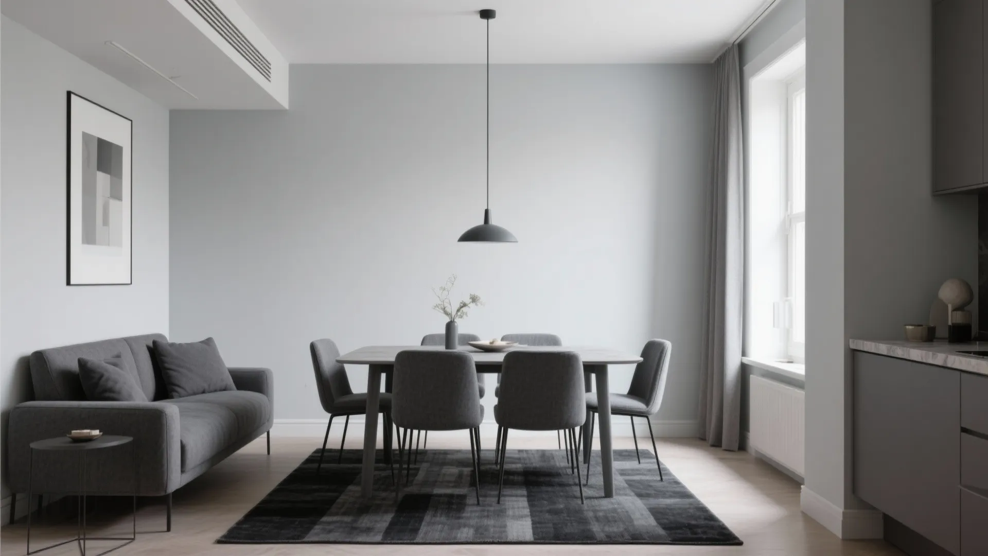 Modern grey dining area featuring a dark sofa wooden table black ceiling light and rug