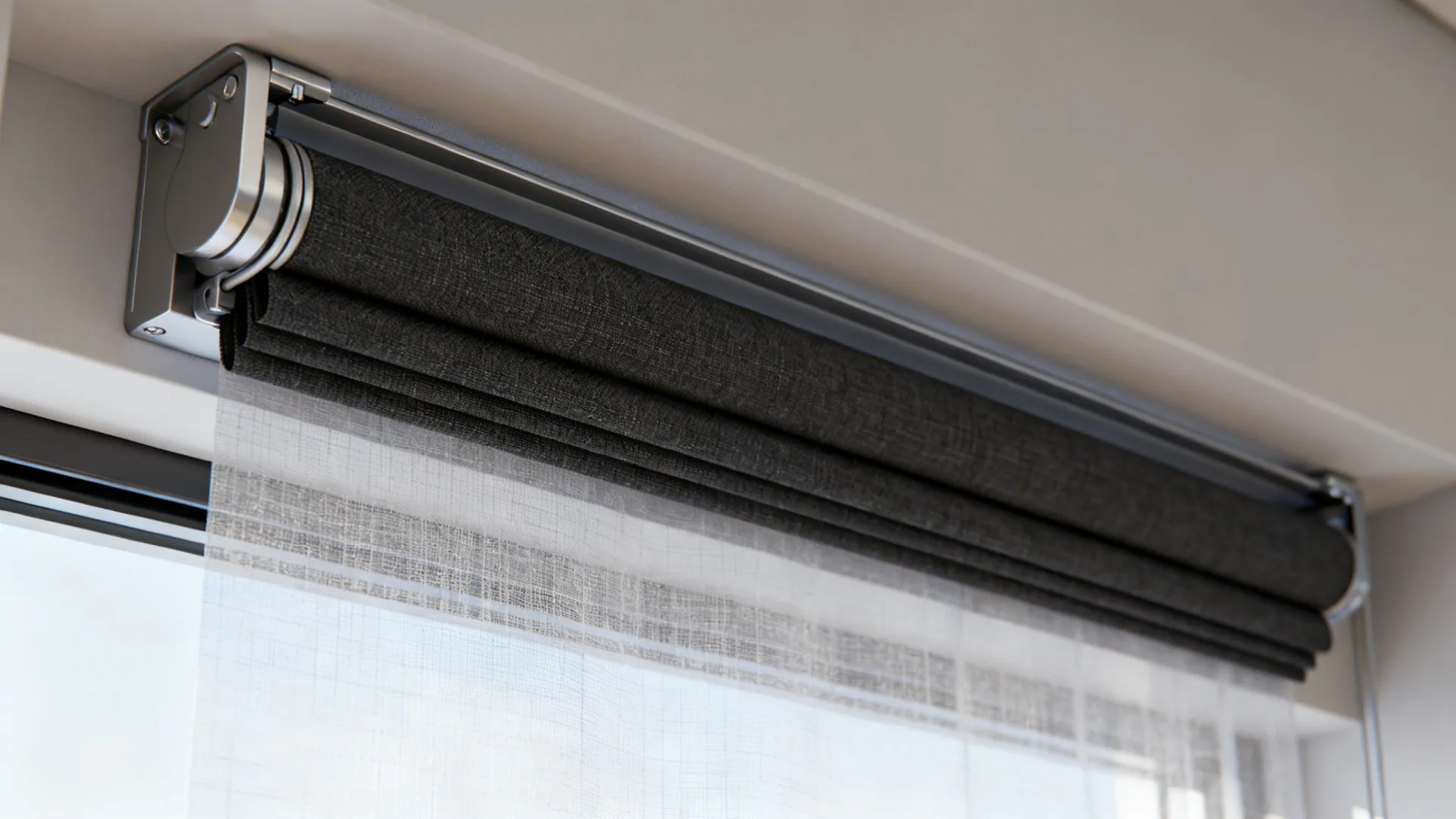 Close-up of layered blackout roller and sheer headrail showing fabric textures