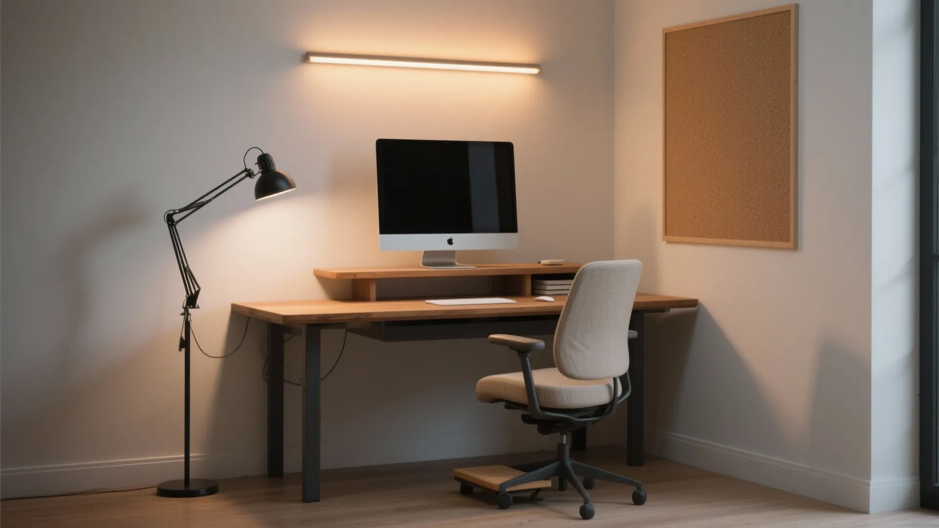 Study desk with task lamp, soft ambient light, and monitor backlight arranged for ergonomic posture