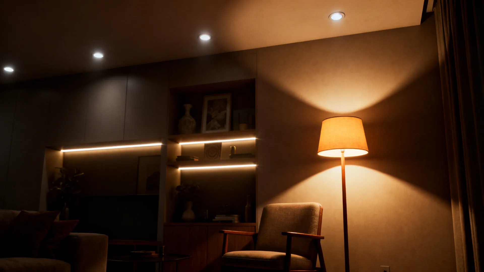 Layered living room lighting with recessed dimmer, floor lamp and shelf accent LEDs.