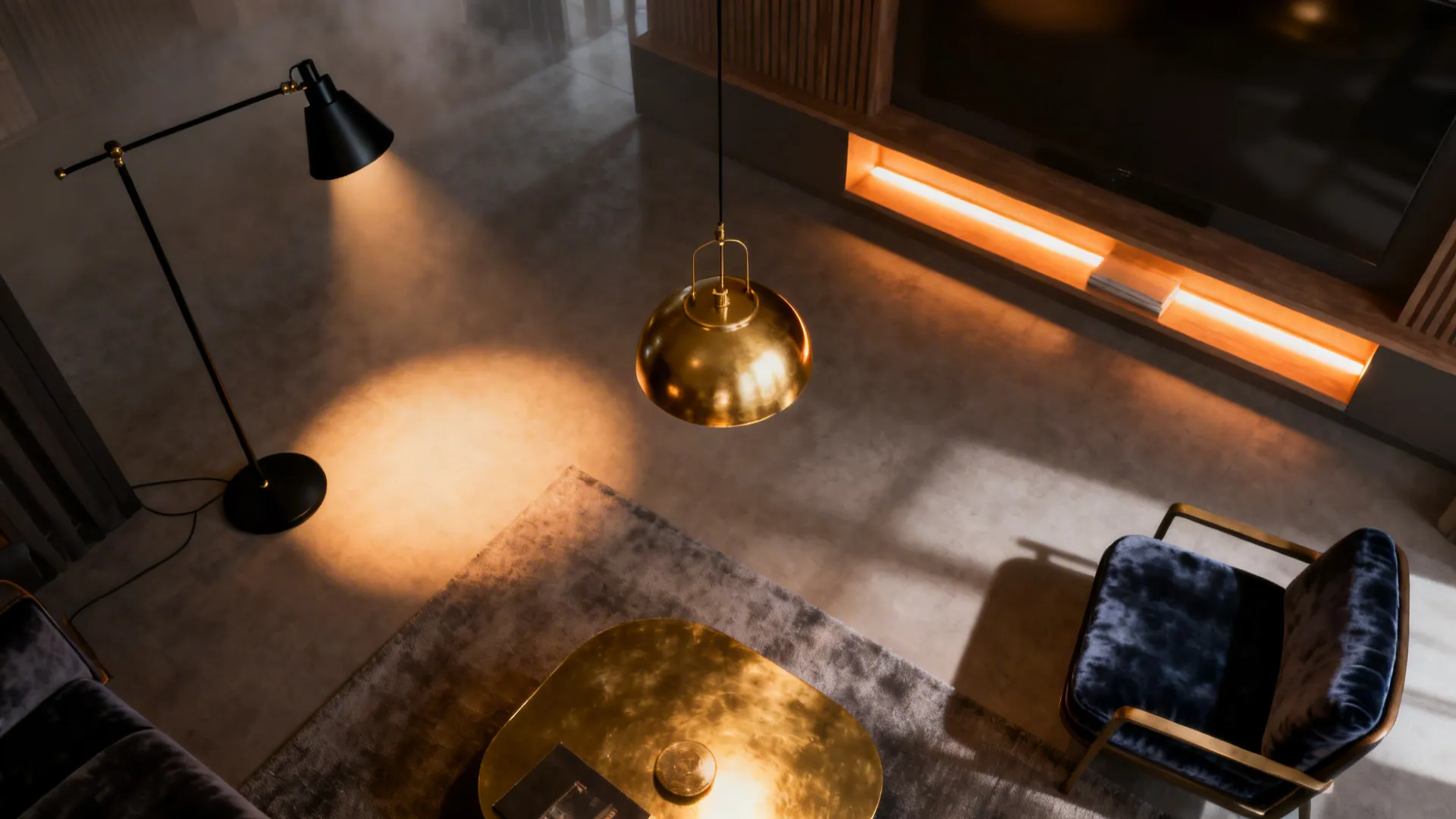 Small living room showing layered lighting: black floor lamp, gold pendant, and warm LED strips illuminating textures.