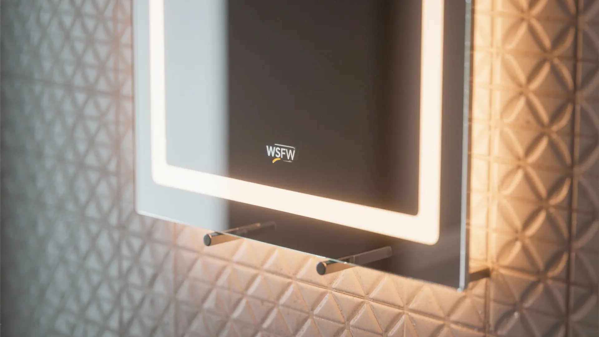 Close-up of modern bathroom mirror with built-in light frame and small shelf on textured wall