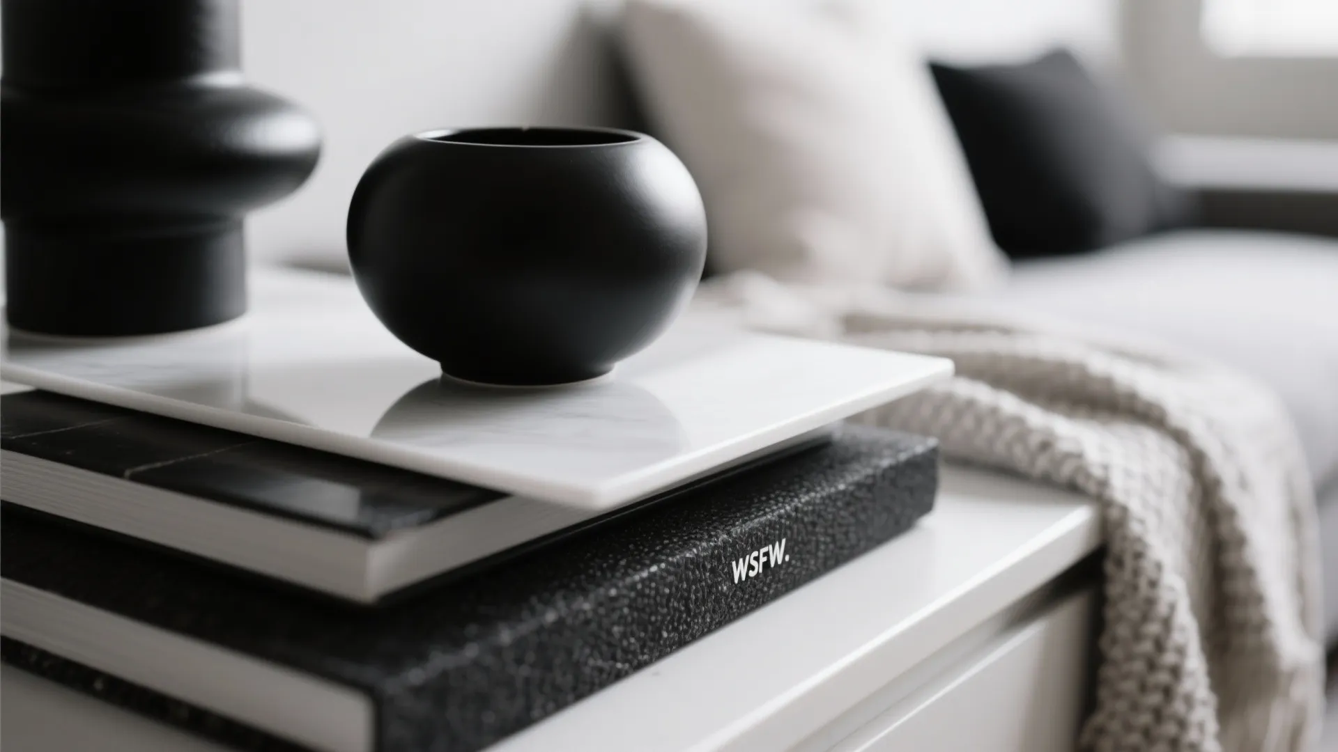 Close-up of black, white, and fabric textures layered in decor