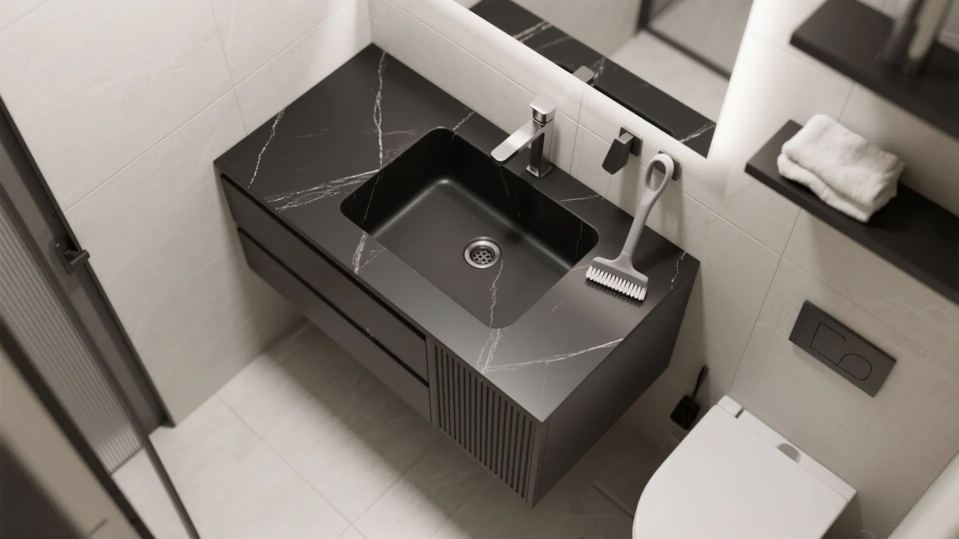Top view of small bathroom layout with black marble sink white toilet and grey floor tiles