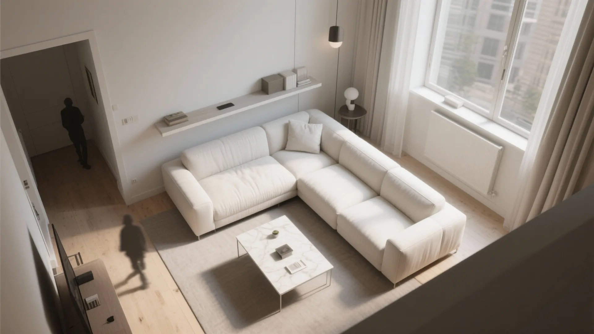Top-down layout of a small living room with a white sofa pulled off the wall and a slim console, showing circulation flow.