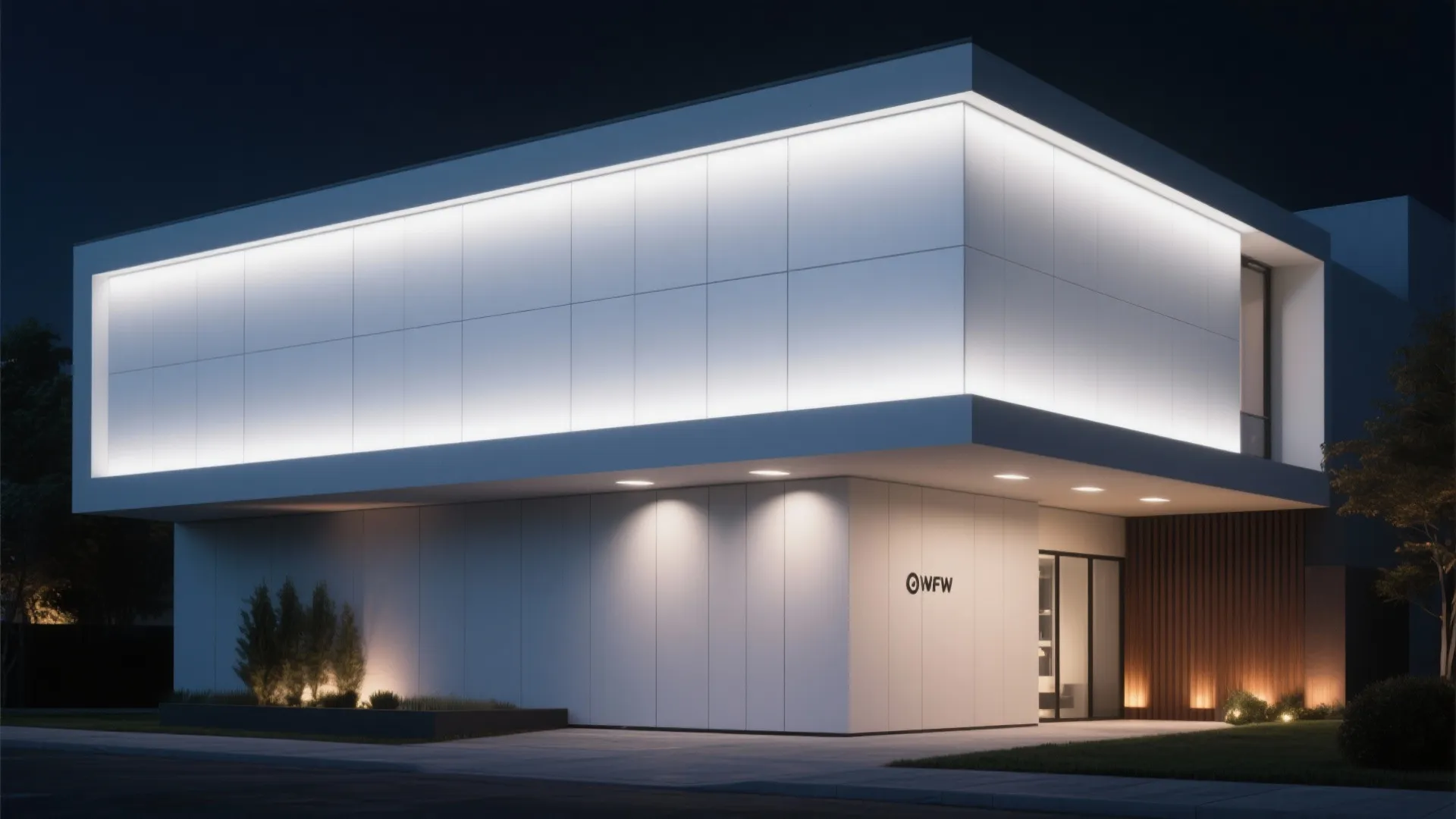 Modern white building at night with bright light panels on exterior walls and glass entrance