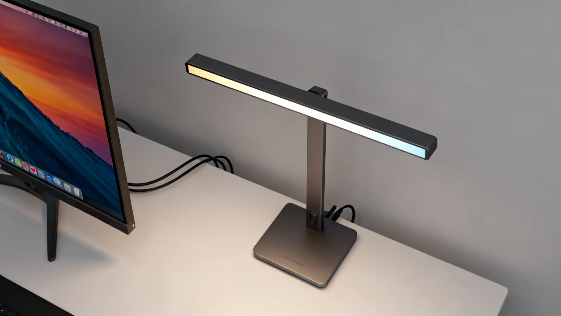 Top-down view of a slim LED table lamp in a compact media corner showing color temperature control