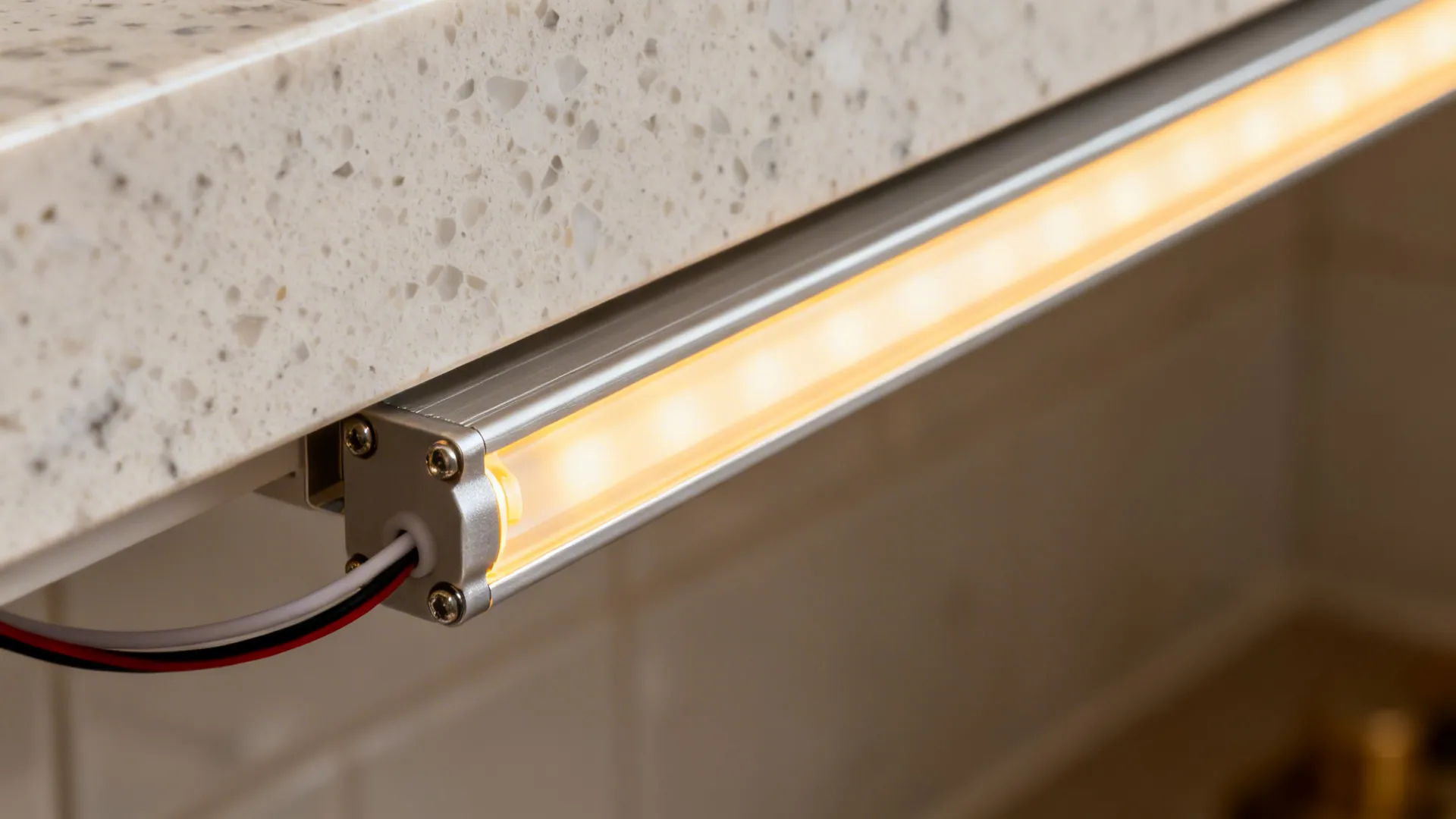 Macro of a dimmable under-cabinet LED strip in an aluminum channel with diffuser.