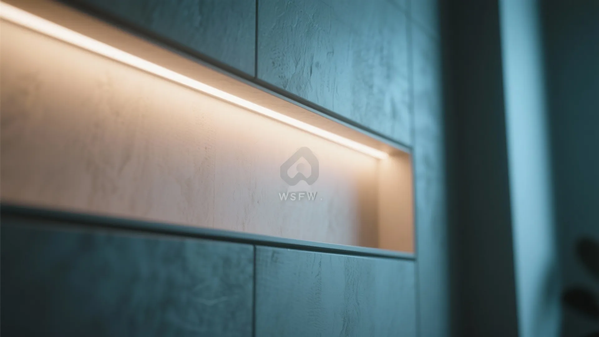 Close up view of warm led strip light installed inside a recessed grey wall panel