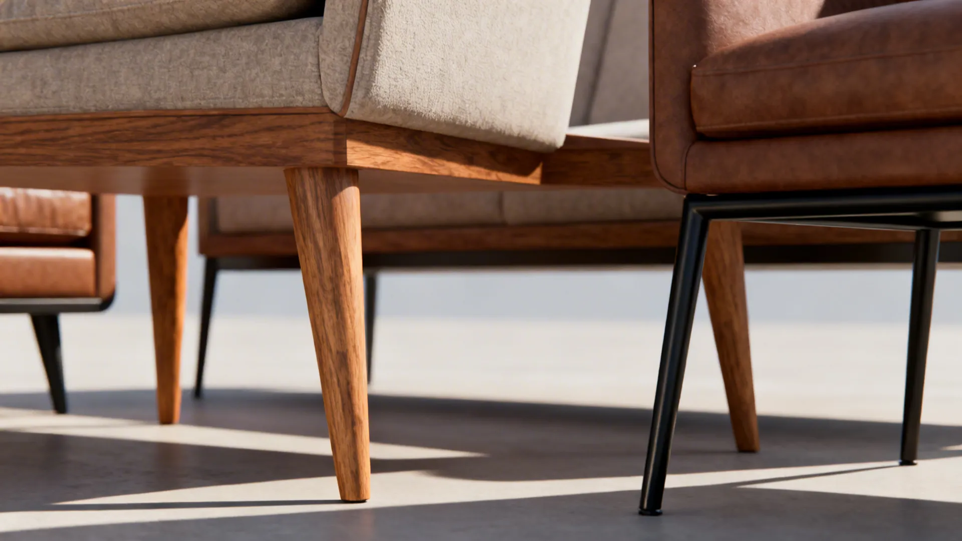Detail of tapered wooden and slim metal furniture legs unifying different seating styles.