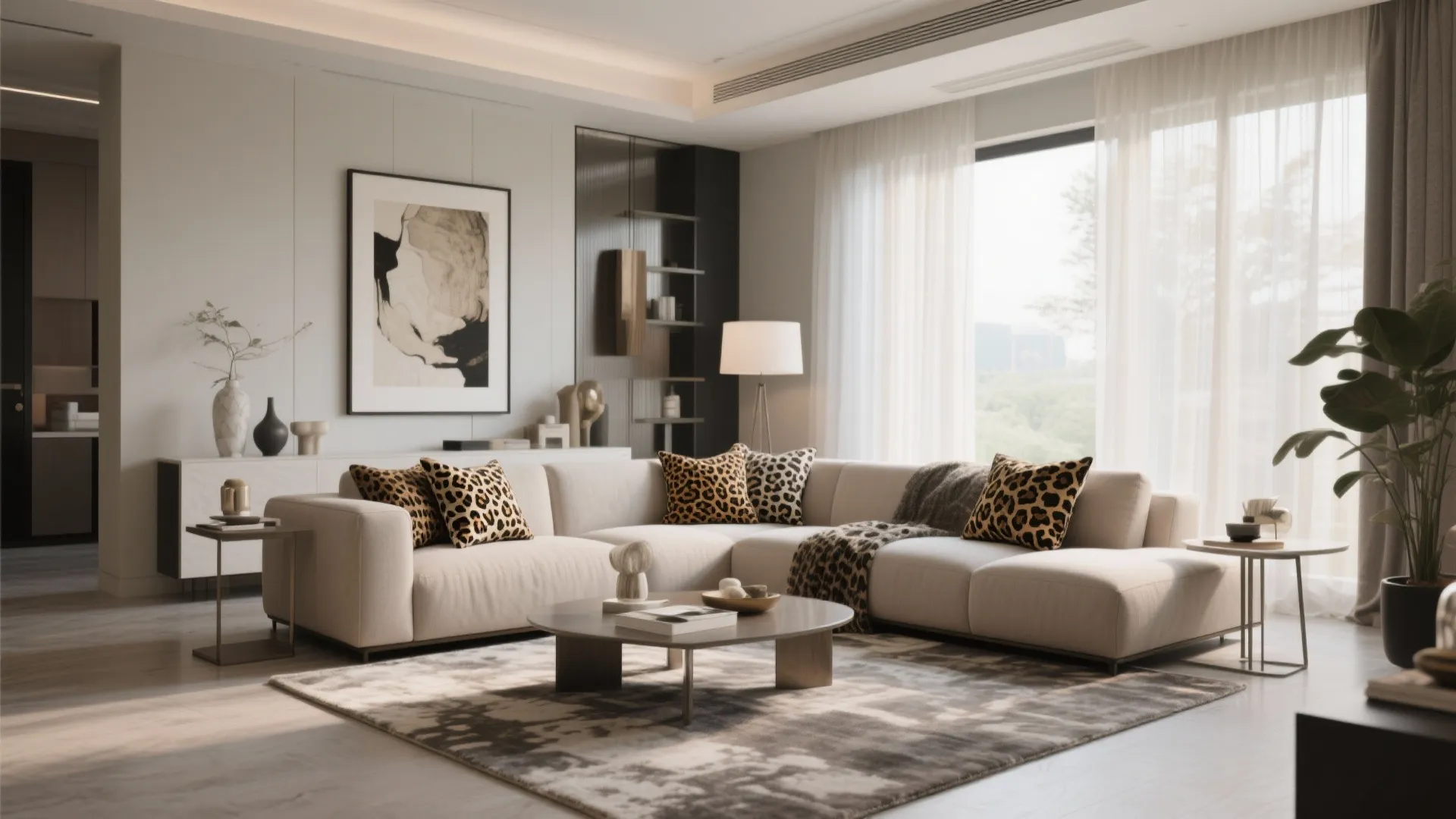 Modern living room with white corner sofa leopard print pillows round coffee table and large windows