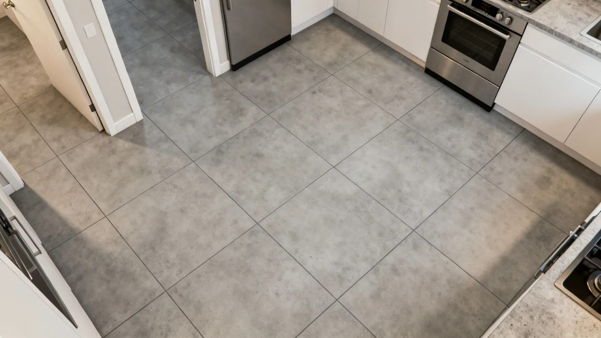 Top-down view of large-format concrete-look tiles aligned to enhance continuous sightlines.