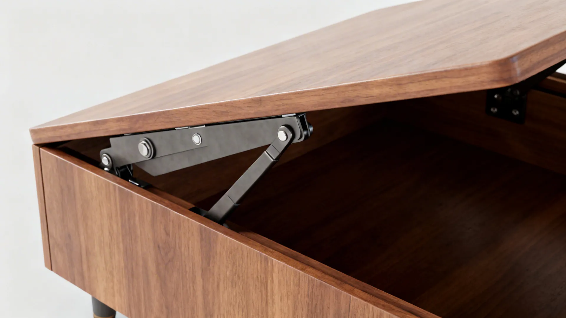 Macro view of robust metal lift-top coffee table hardware against warm wood.