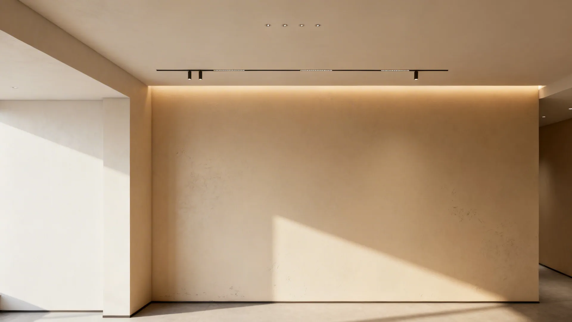 LED cove and recessed lighting lifting a pale warm ceiling in a basement studio.