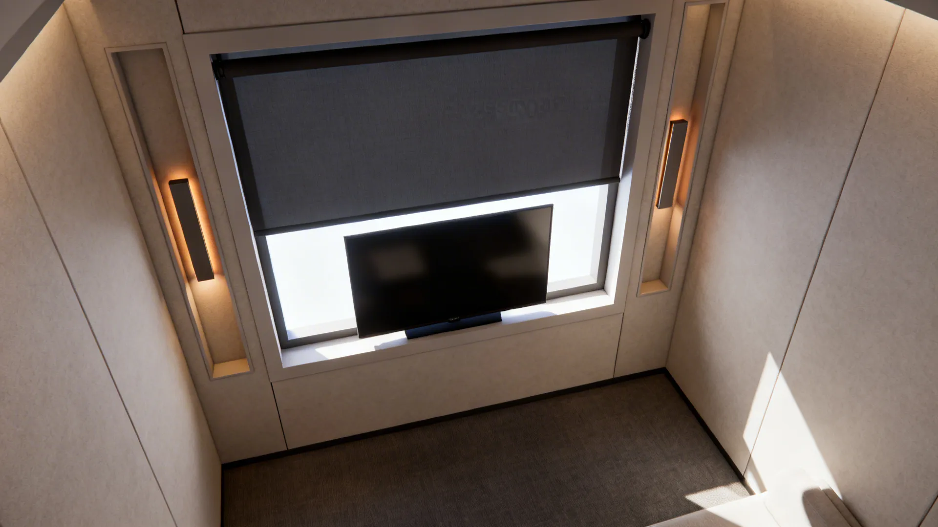 Top-down view showing blackout shades and a TV with neutral bias lighting for glare control.