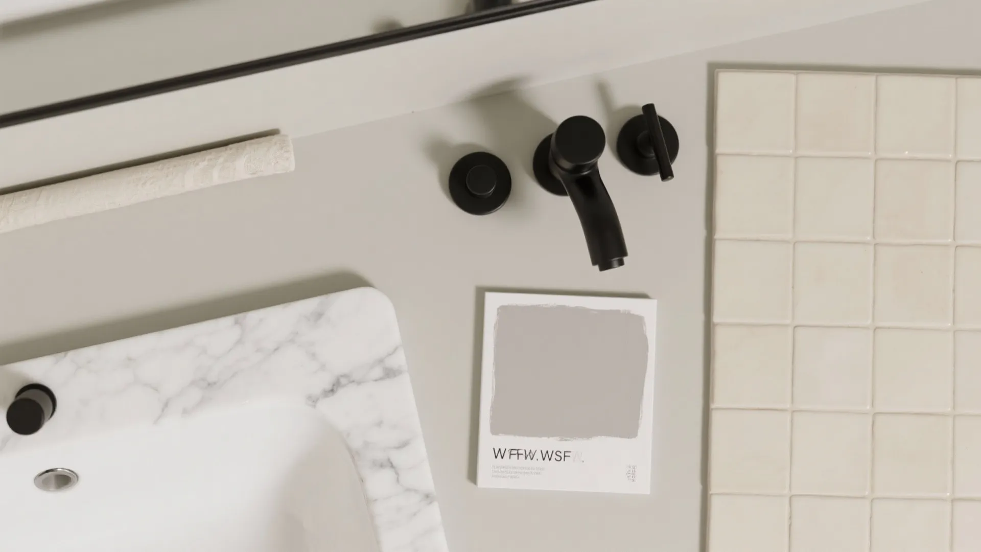 Top view of marble sink with black faucet and light grey color sample on bathroom counter