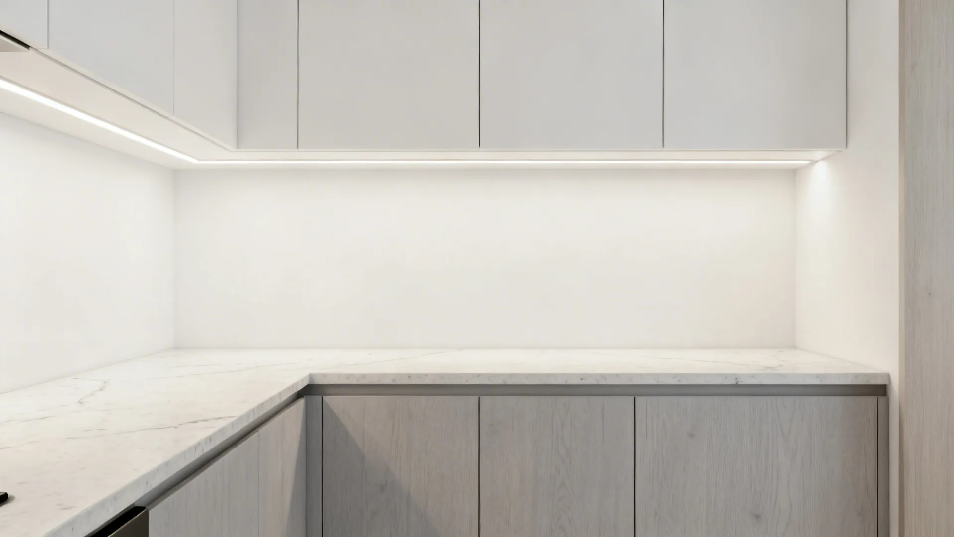 Bright 9x8 kitchen with high-LRV paint, satin backsplash, and pale quartz tops.