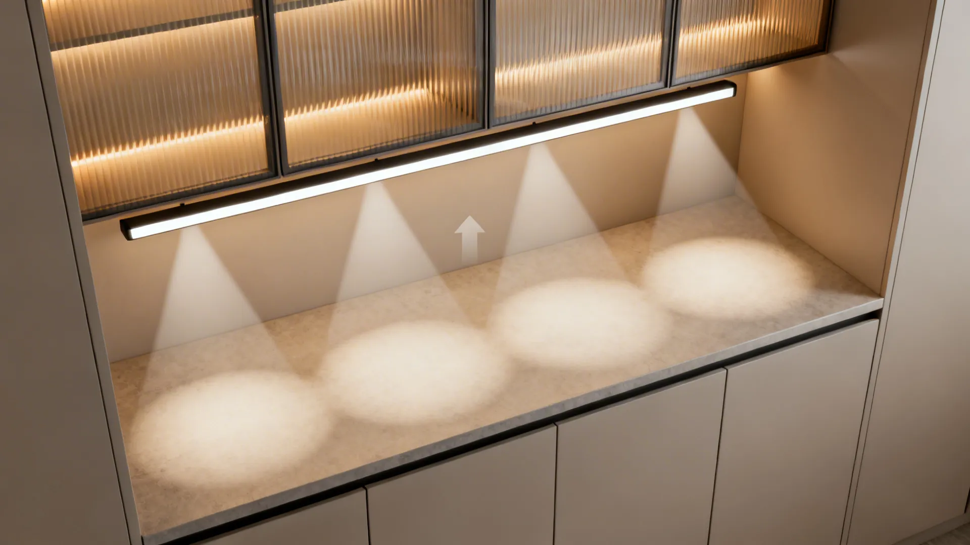 Top-down view showing under-cabinet task lighting, ambient track light, and accent glow over a handleless counter.