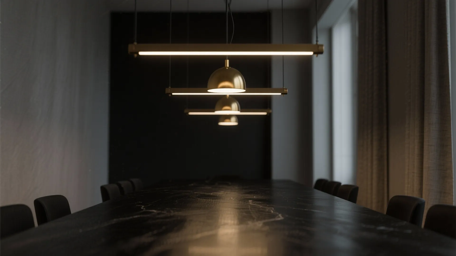 Modern black dining table with elegant ceiling light fixtures in a dark moody dining room