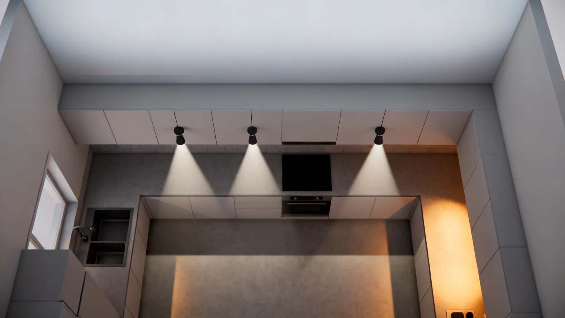 Top down view of kitchen layout with three black ceiling lights over white stone counter