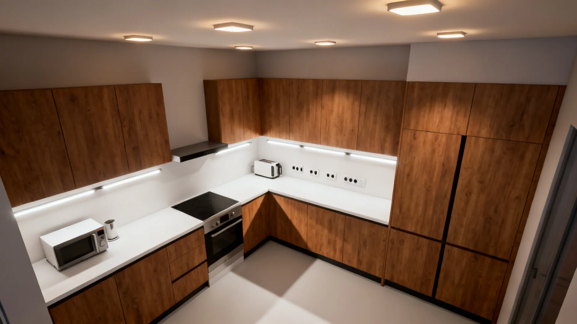 Top-down view showing under-cabinet task lighting and thoughtfully placed outlets in a compact kitchen.