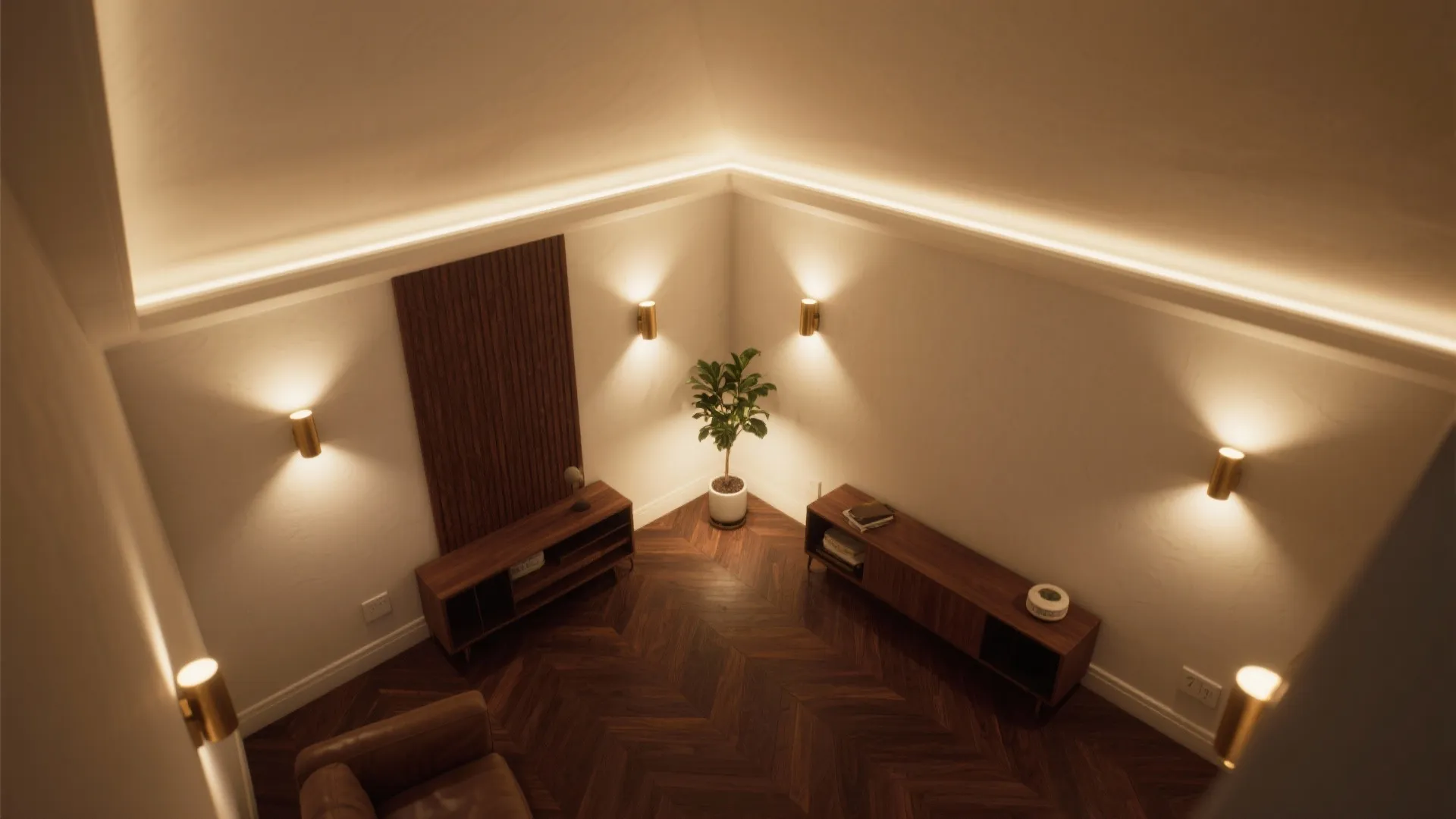 Top down view of a room with wall lights green plant and dark wood floor layout