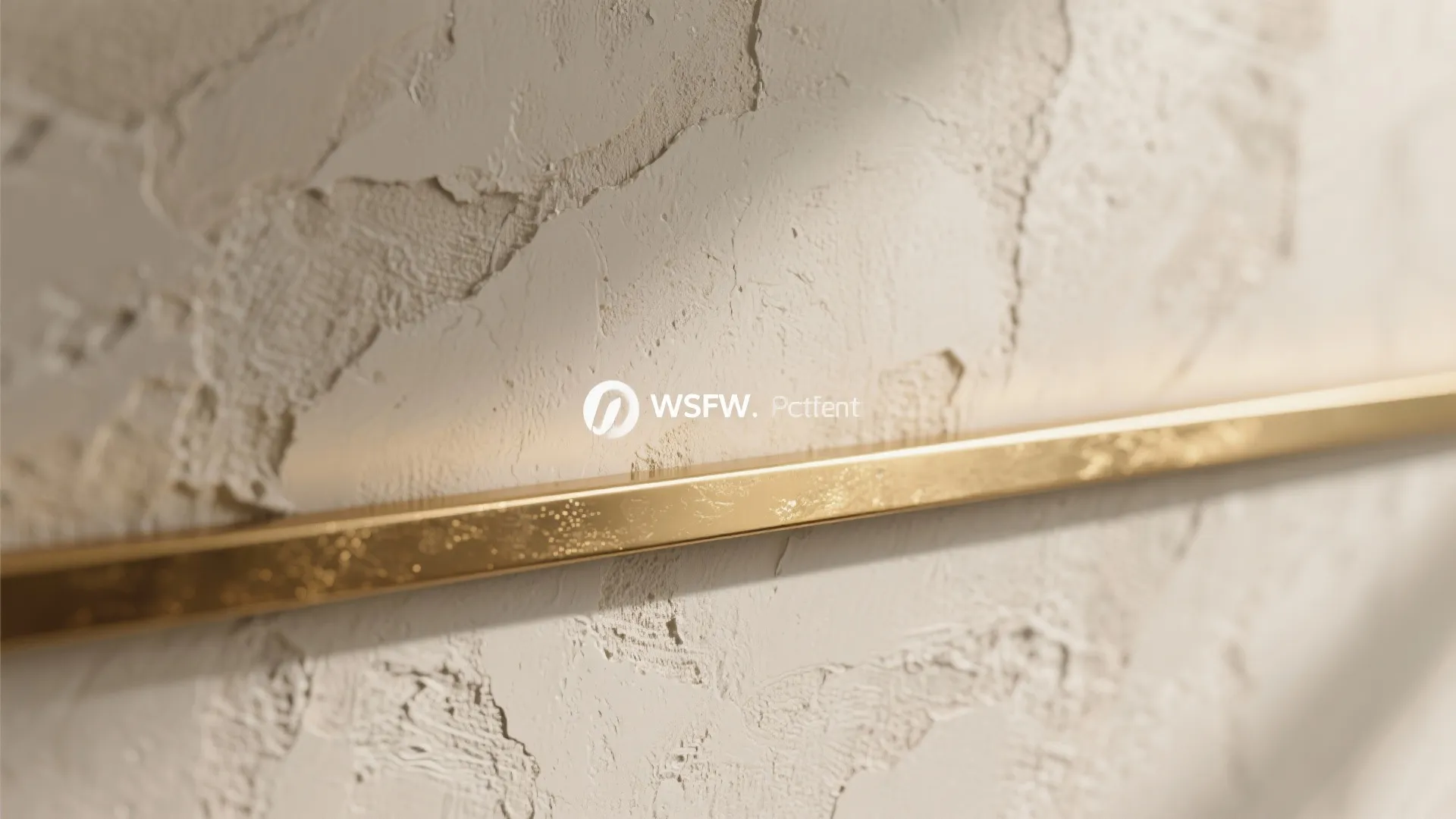Textured lime plaster or microcement wall with brass accents