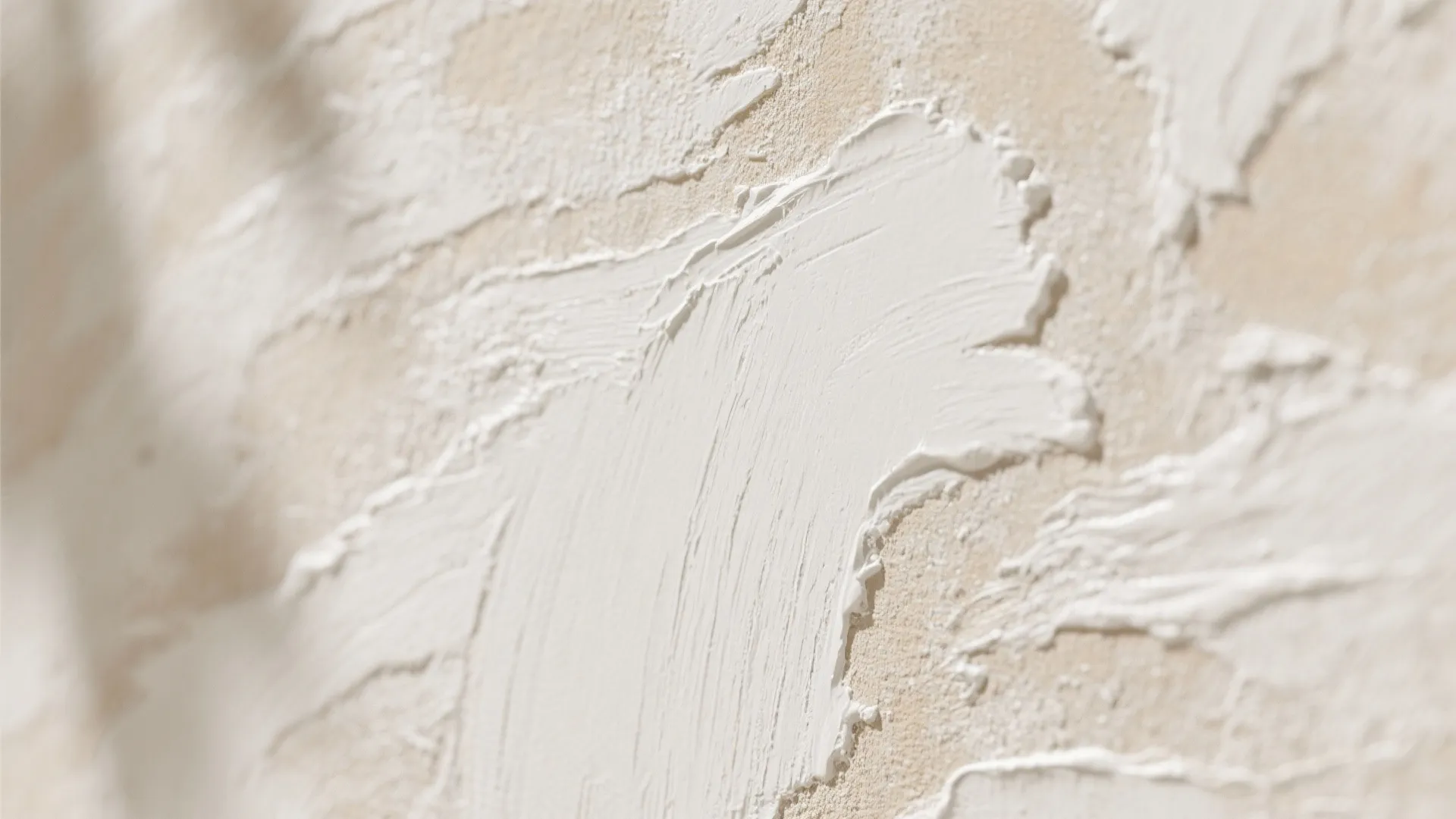 Close-up of chalky limewash mineral paint on a cement surface showing breathable, textured patina.
