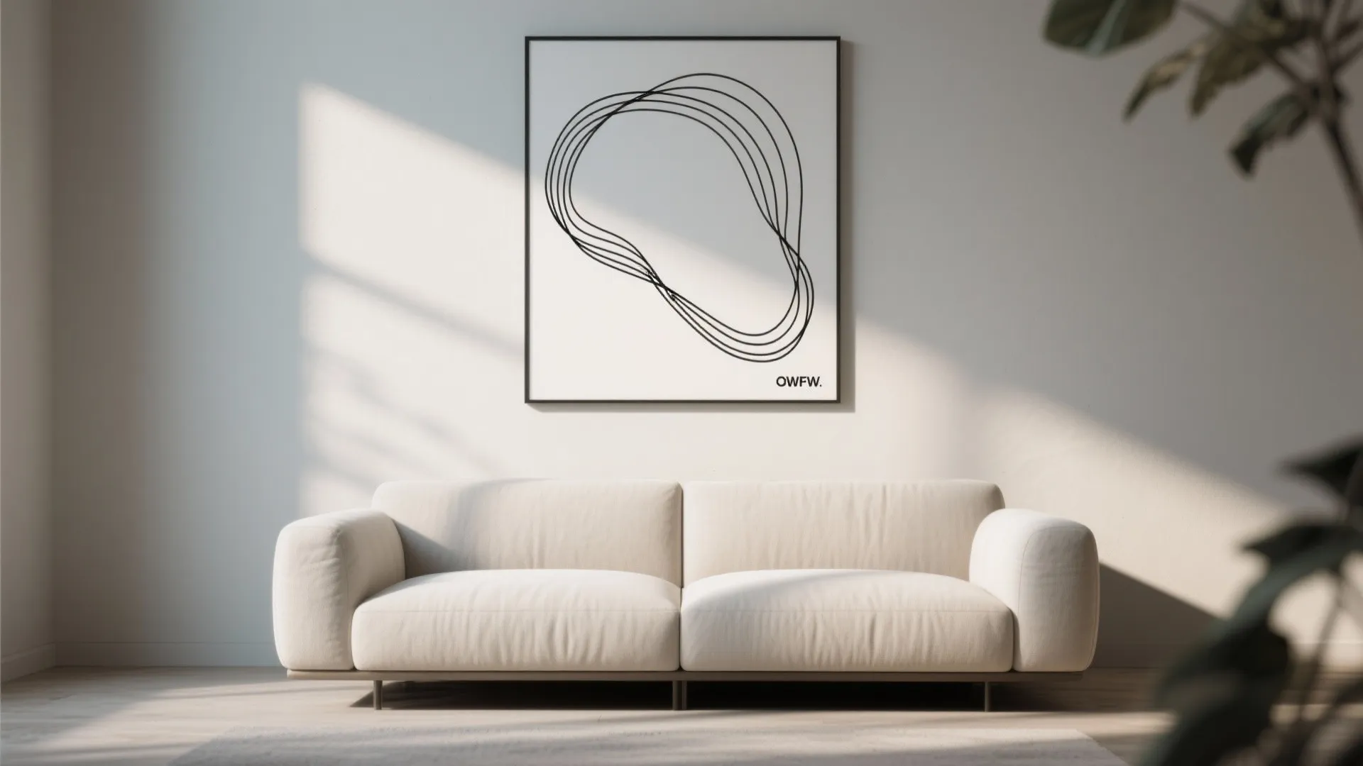 Modern living room with a white sofa and abstract line art hanging on the wall