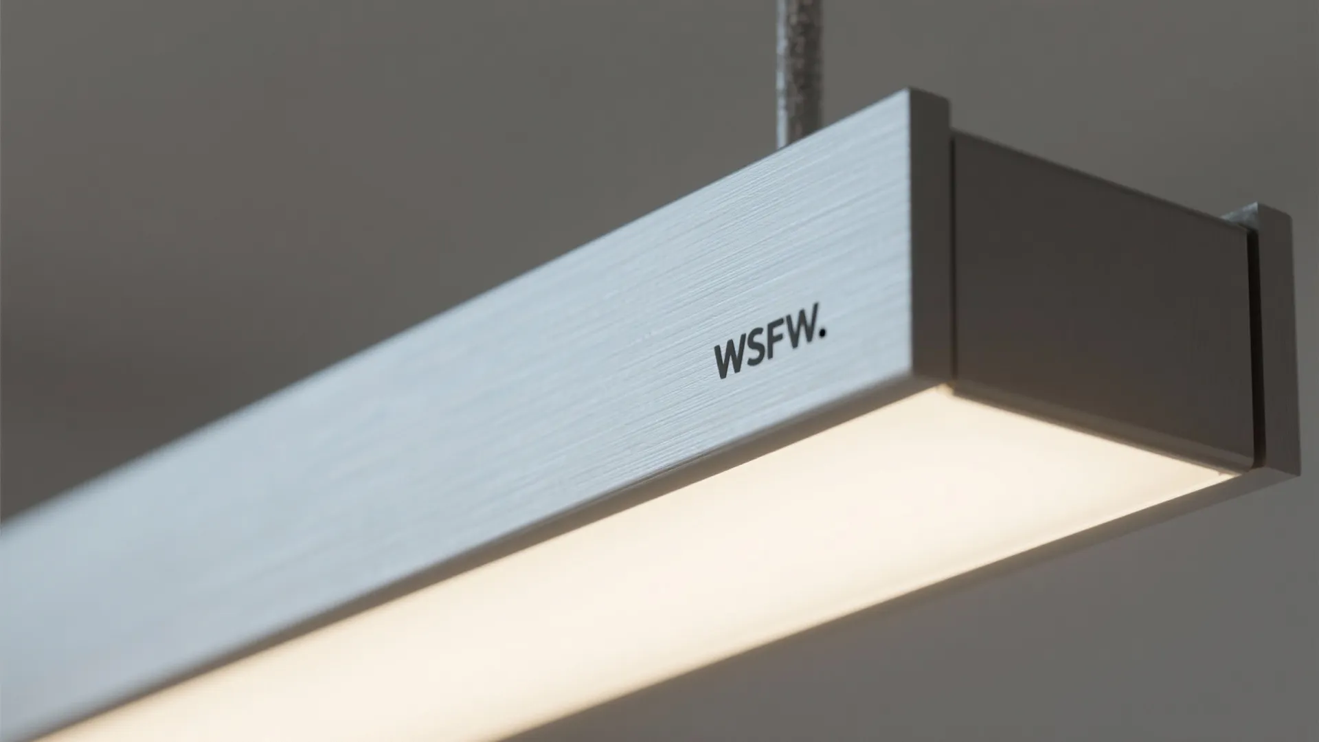 Linear LED chandelier over a tight seating zone