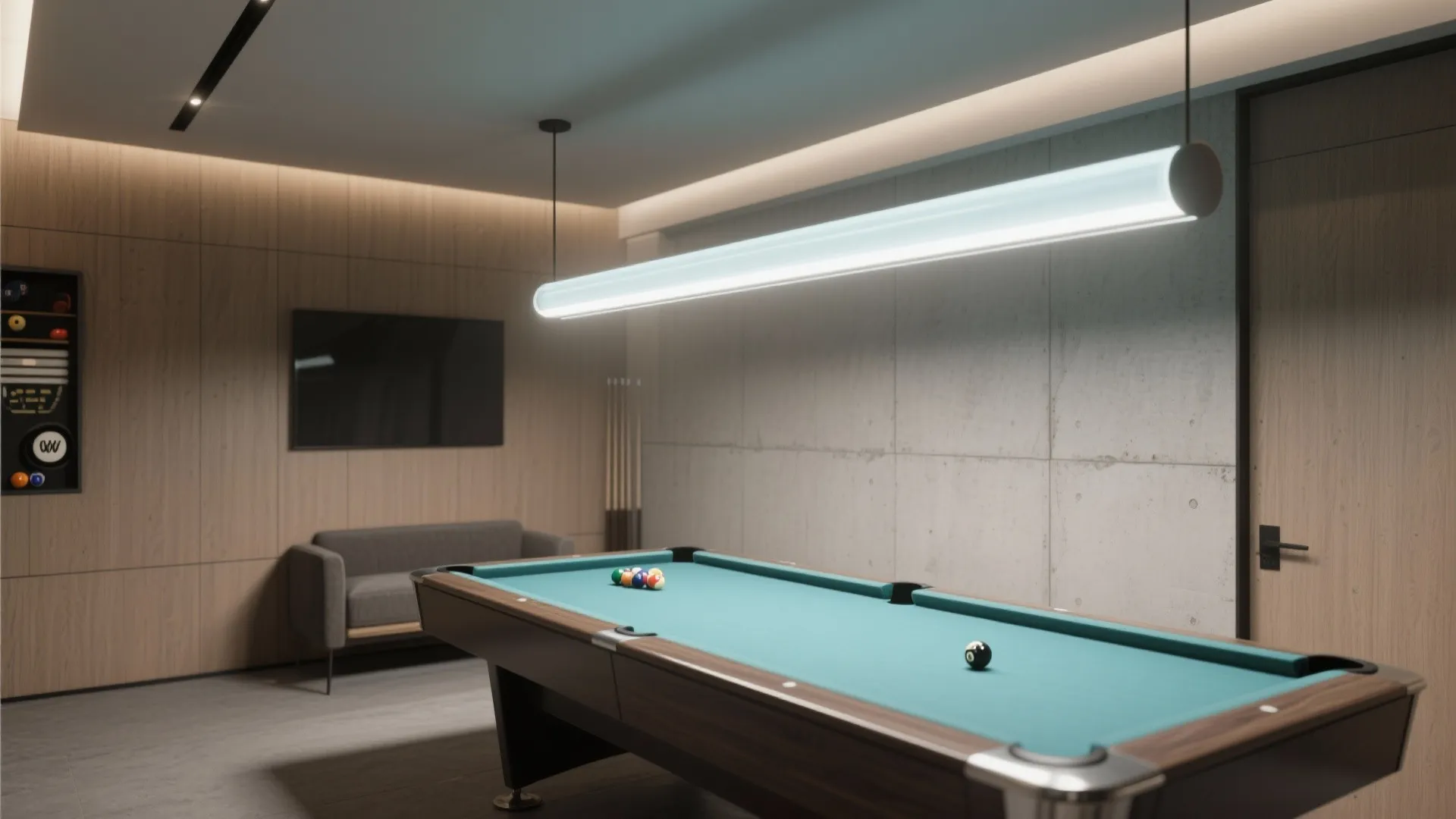 Modern game room with pool table under long white ceiling light and grey sofa furniture