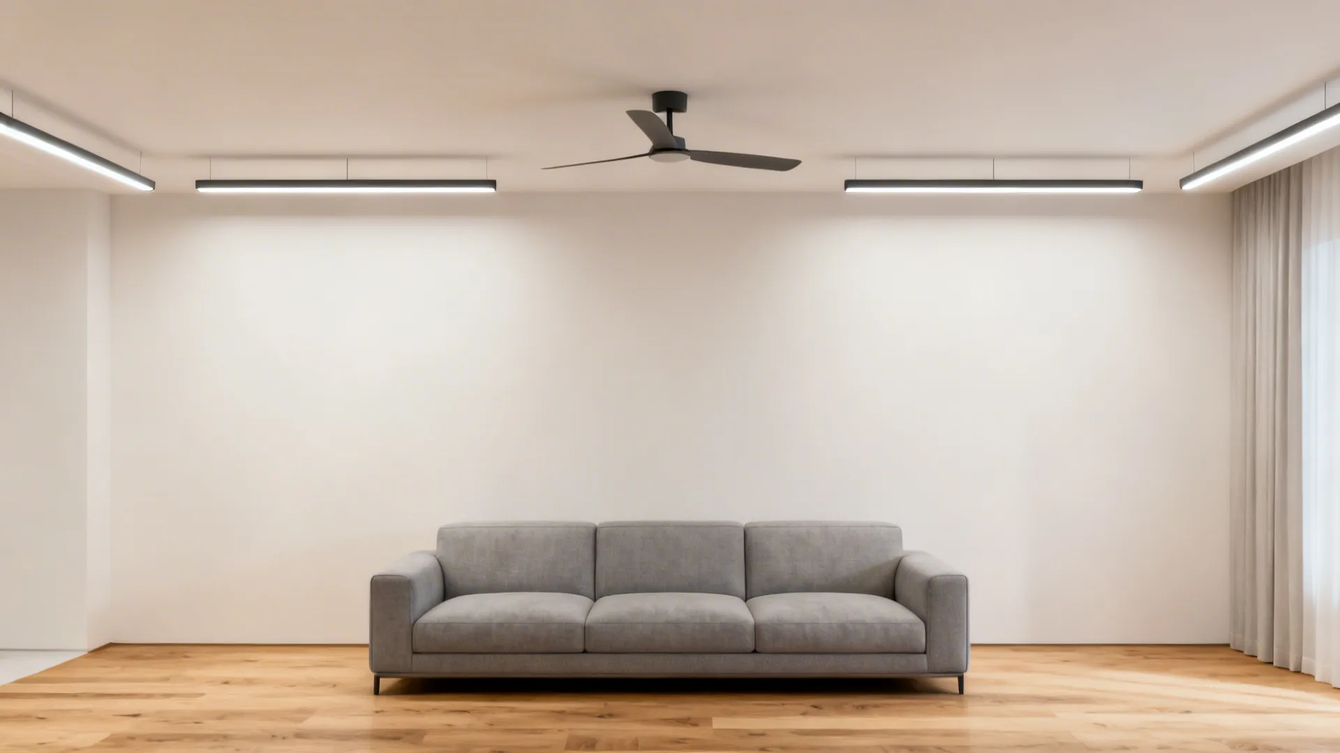 Minimalist ceiling with two slim ceiling fans centered between linear light rails.