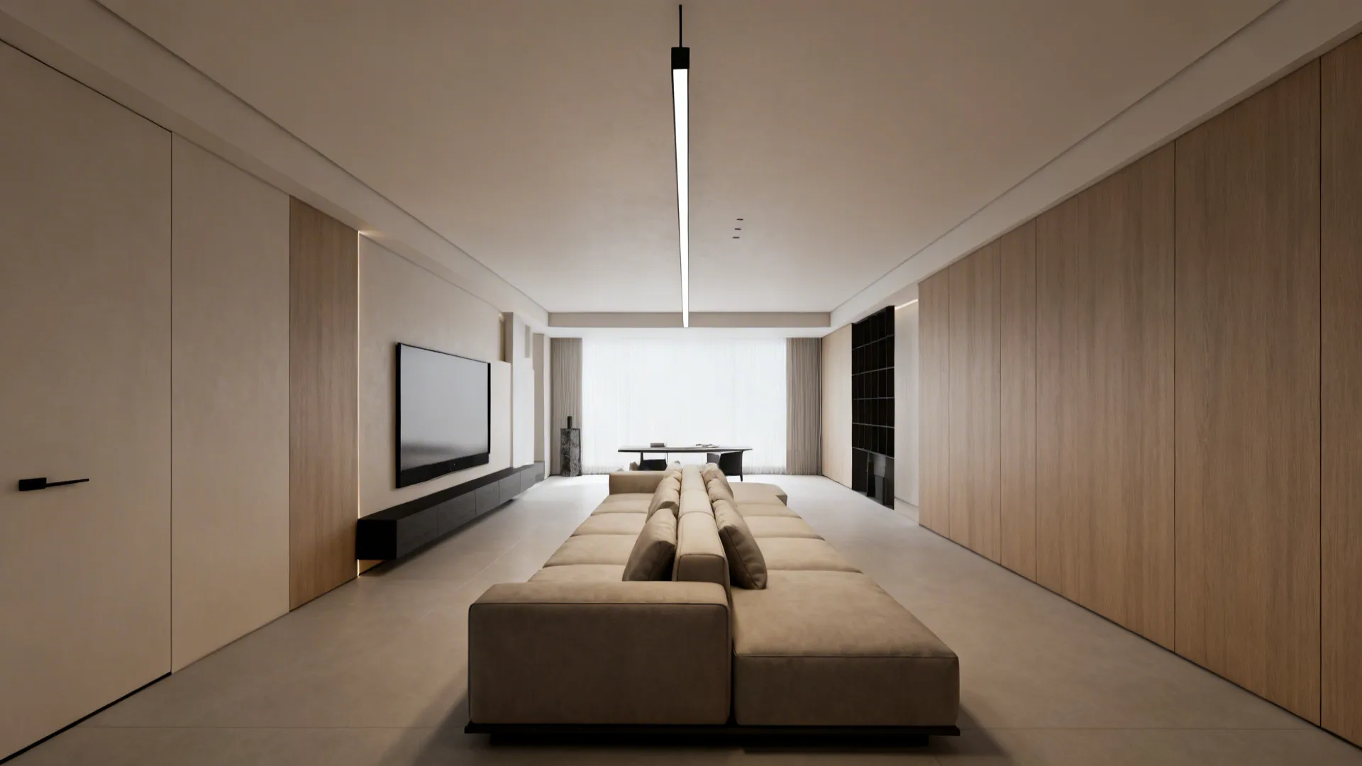 Elongated living room with a sleek linear pendant above a long sectional sofa for even lighting.