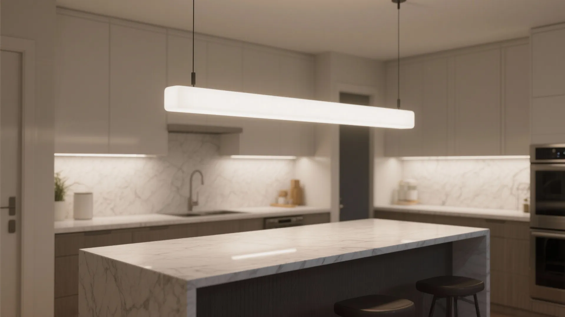 Small kitchen peninsula lit by a matte white linear pendant bar with even frosted diffusion.