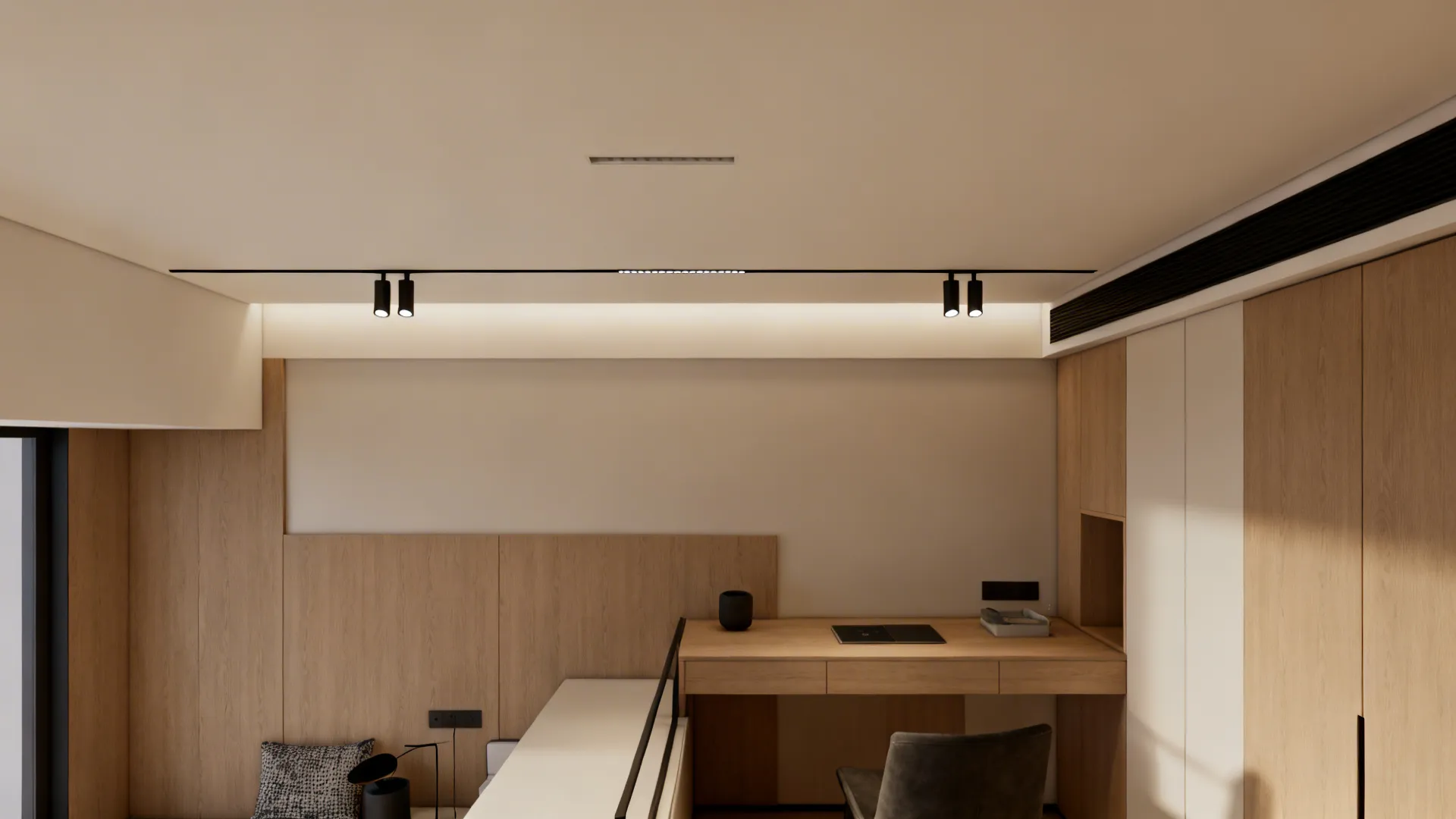 Low-ceiling loft with a slim flush-mounted track lighting system and clean sightlines.