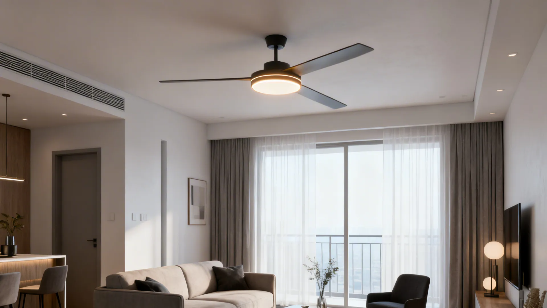 Black ceiling fan with light in a modern living room featuring a sofa and windows