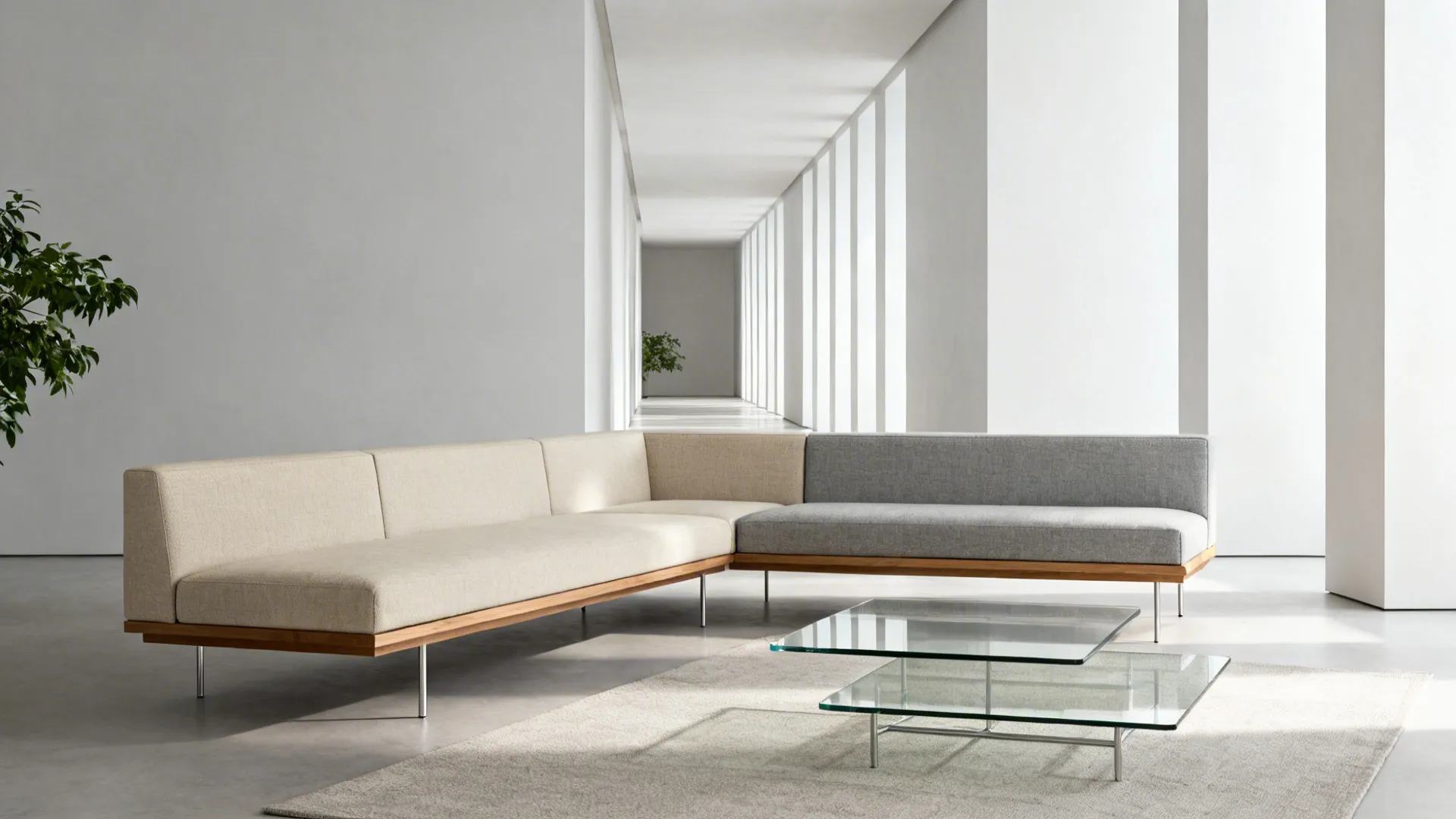 Modern L shaped sofa with beige and grey cushions in a bright minimalist white room