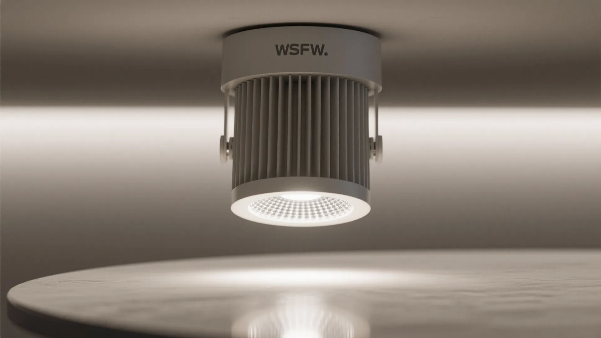 Close up of a modern white ceiling light fixture with textured lens and soft glow