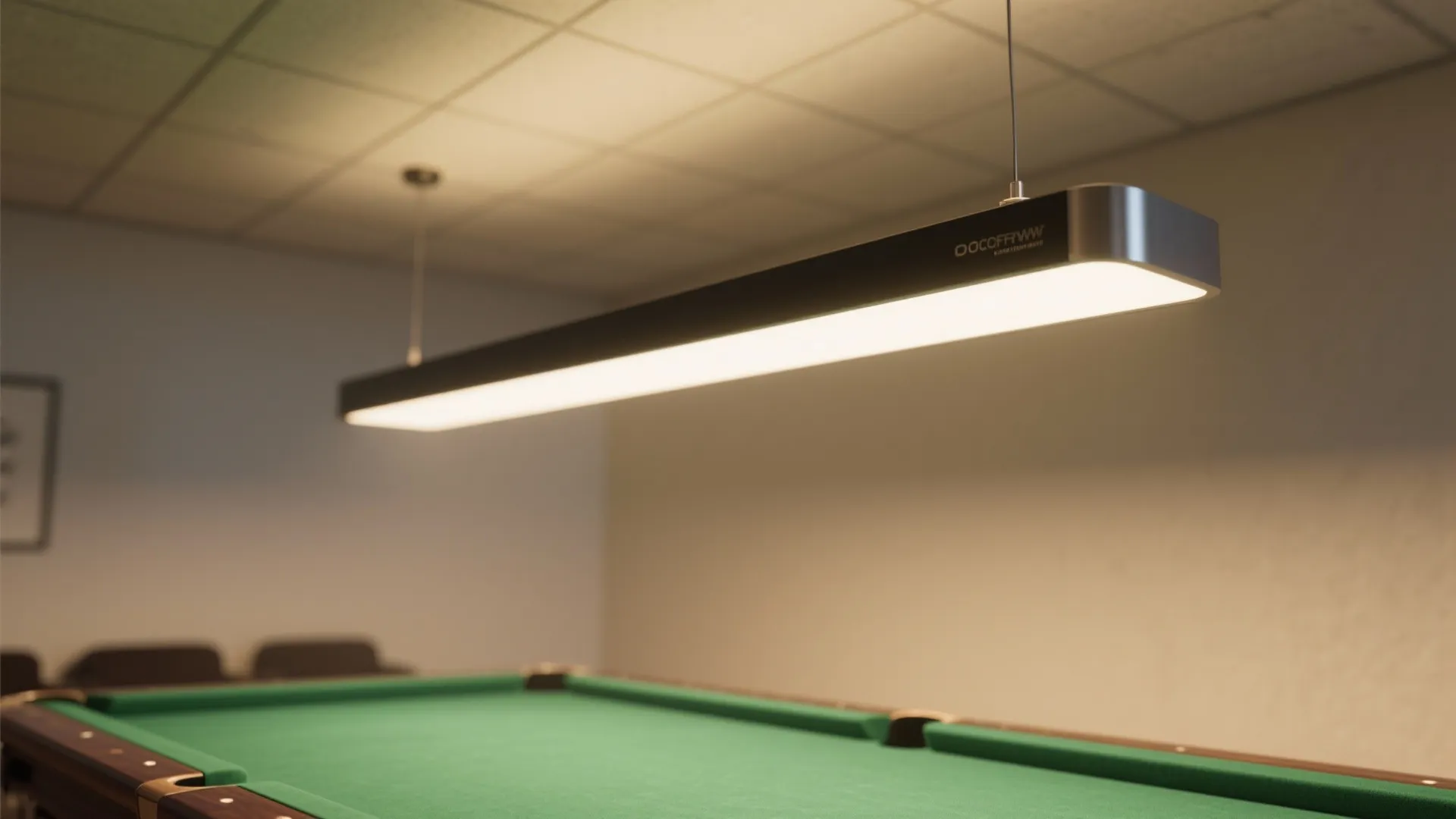 Modern linear ceiling light fixture hanging over a green pool table in a bright room