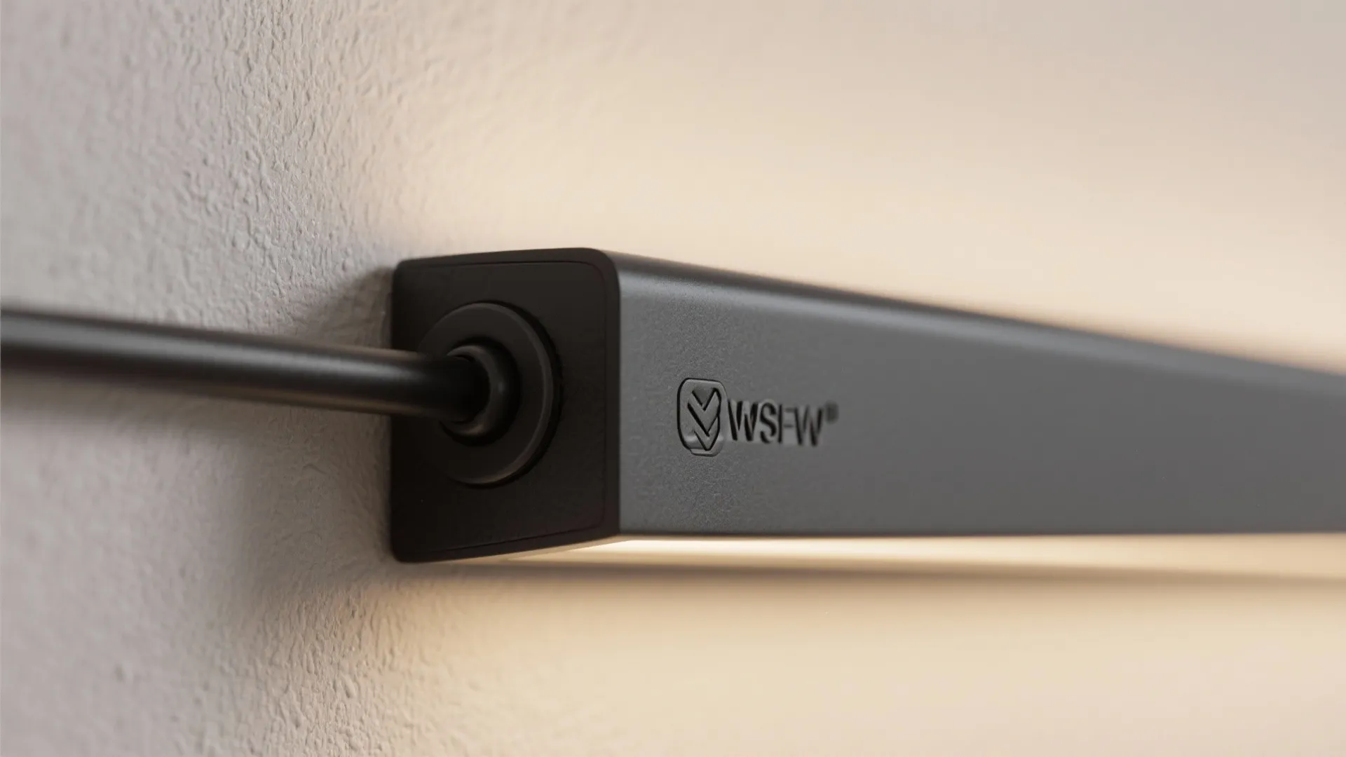 Minimalist wall-mounted track wash