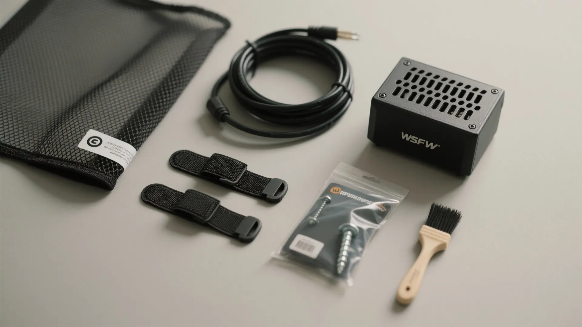 Electronic maintenance kit containing power cable black device cleaning brush screws storage bag and cable ties