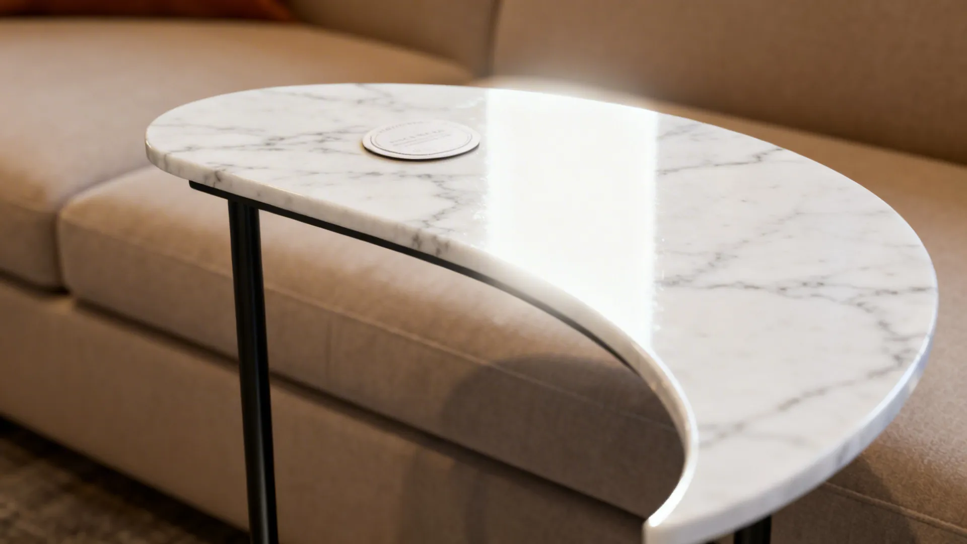 White marble top C-table with slim black frame providing elegant contrast in a small living room.
